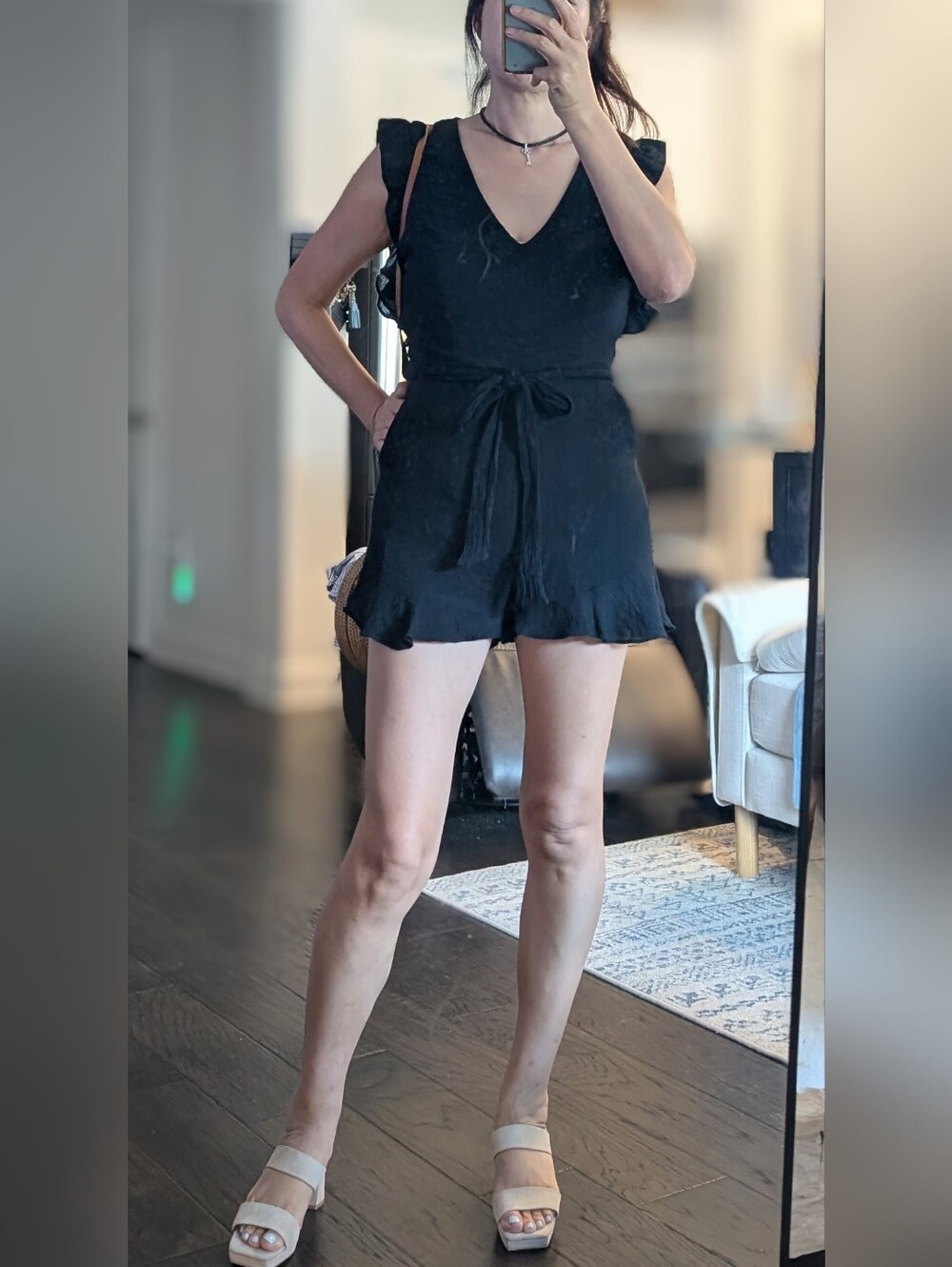 eesome Black Sleeveless Ruffled Romper with V-Neckee